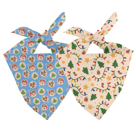 Two colorful pet bandanas with Christmas-themed patterns on a white background.