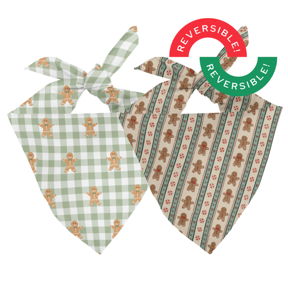 Two dog bandanas with gingerbread man patterns on a white background